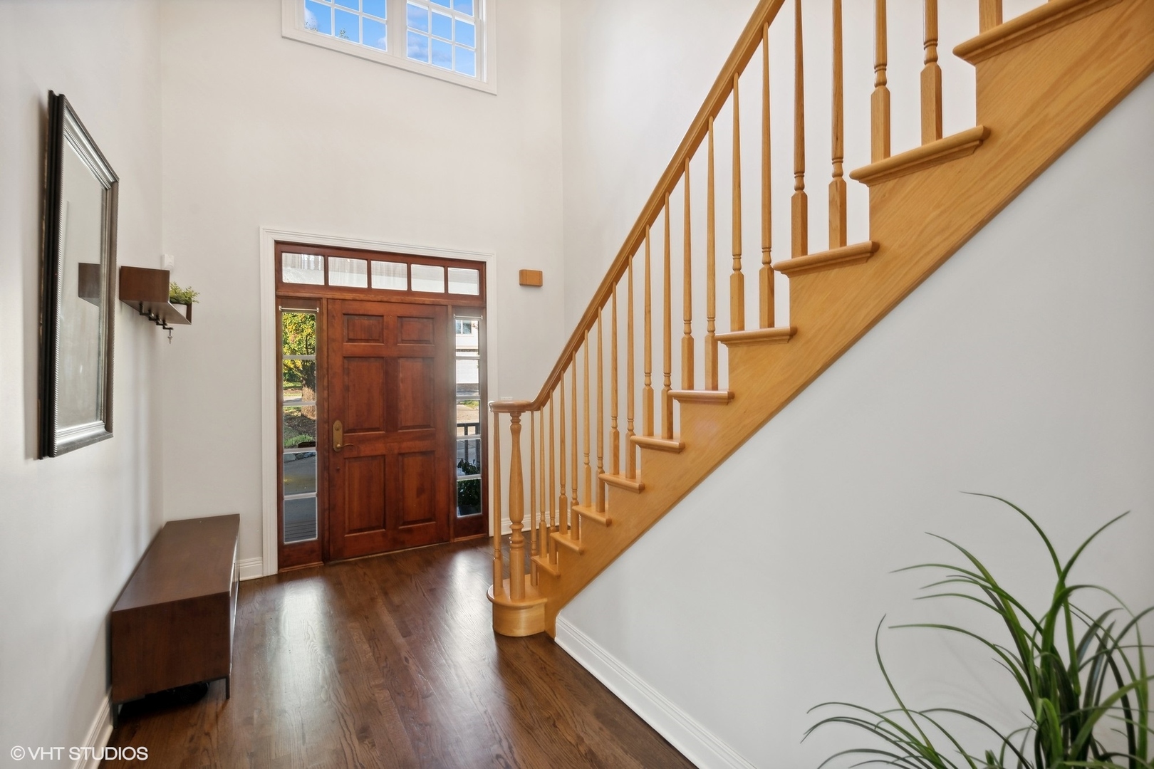 617 Hillside Road Glenview, IL 60025 - Photo 3 of 40 a view of entryway with wooden floor and stairs