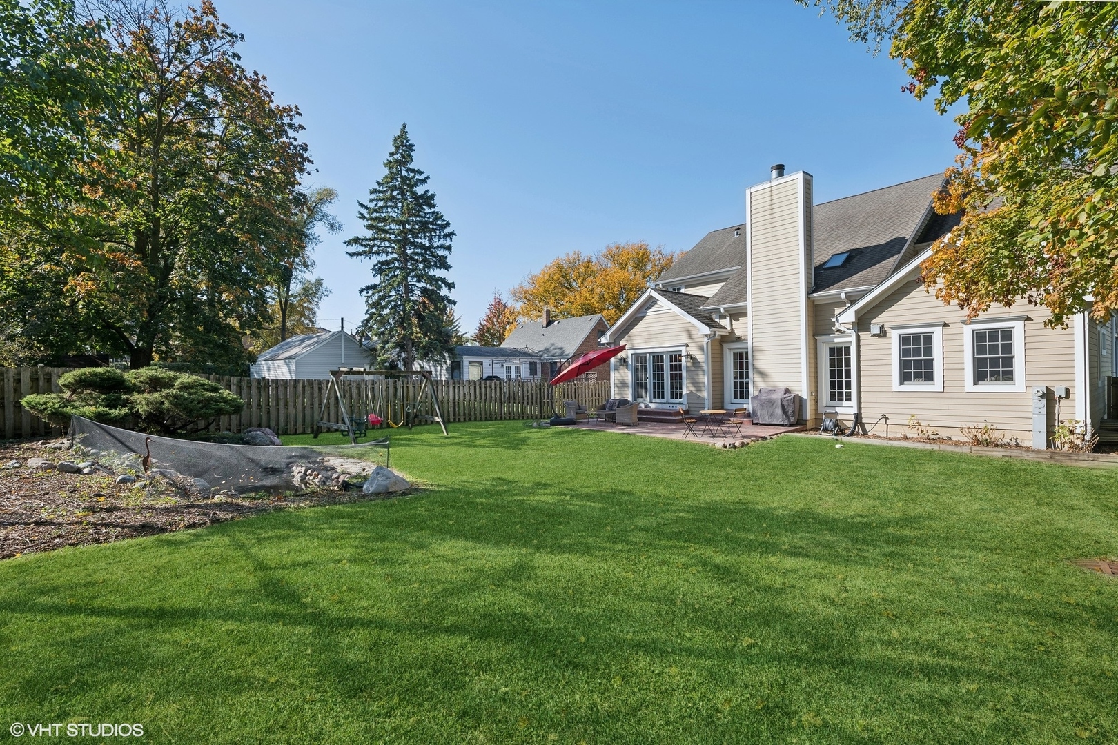617 Hillside Road Glenview, IL 60025 - Photo 34 of 40 a view of a house with backyard and a tree