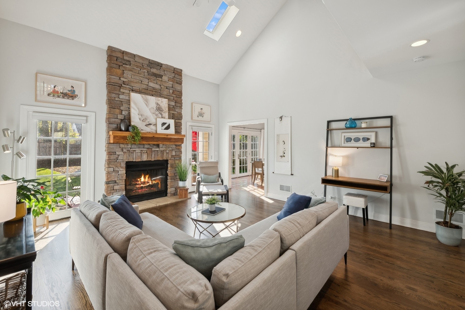 617 Hillside Road Glenview, IL 60025 - Photo 5 of 40 a living room with furniture a potted plant and a fireplace