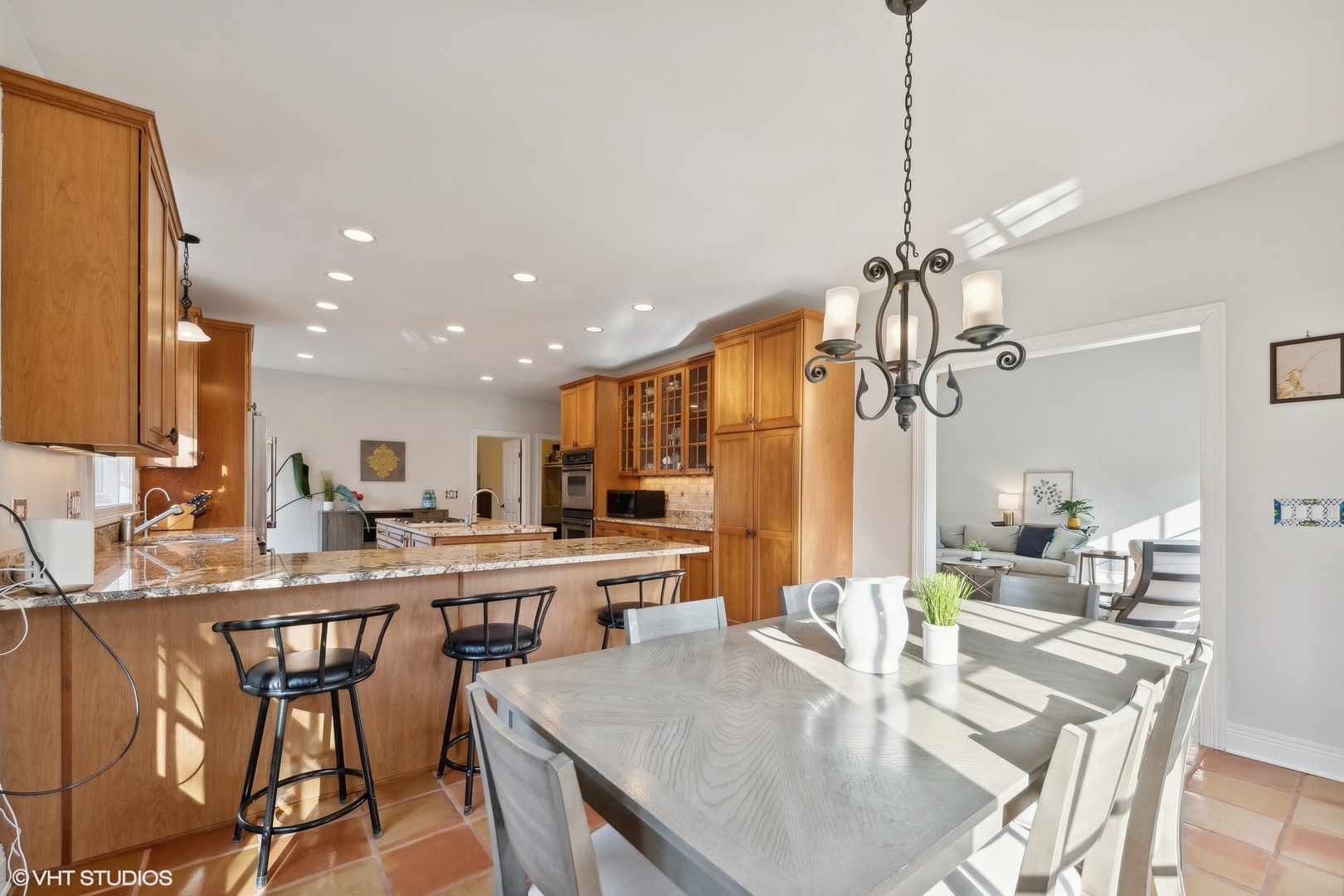 617 Hillside Road Glenview, IL 60025 - Photo 9 of 40 a large kitchen with a table and chairs