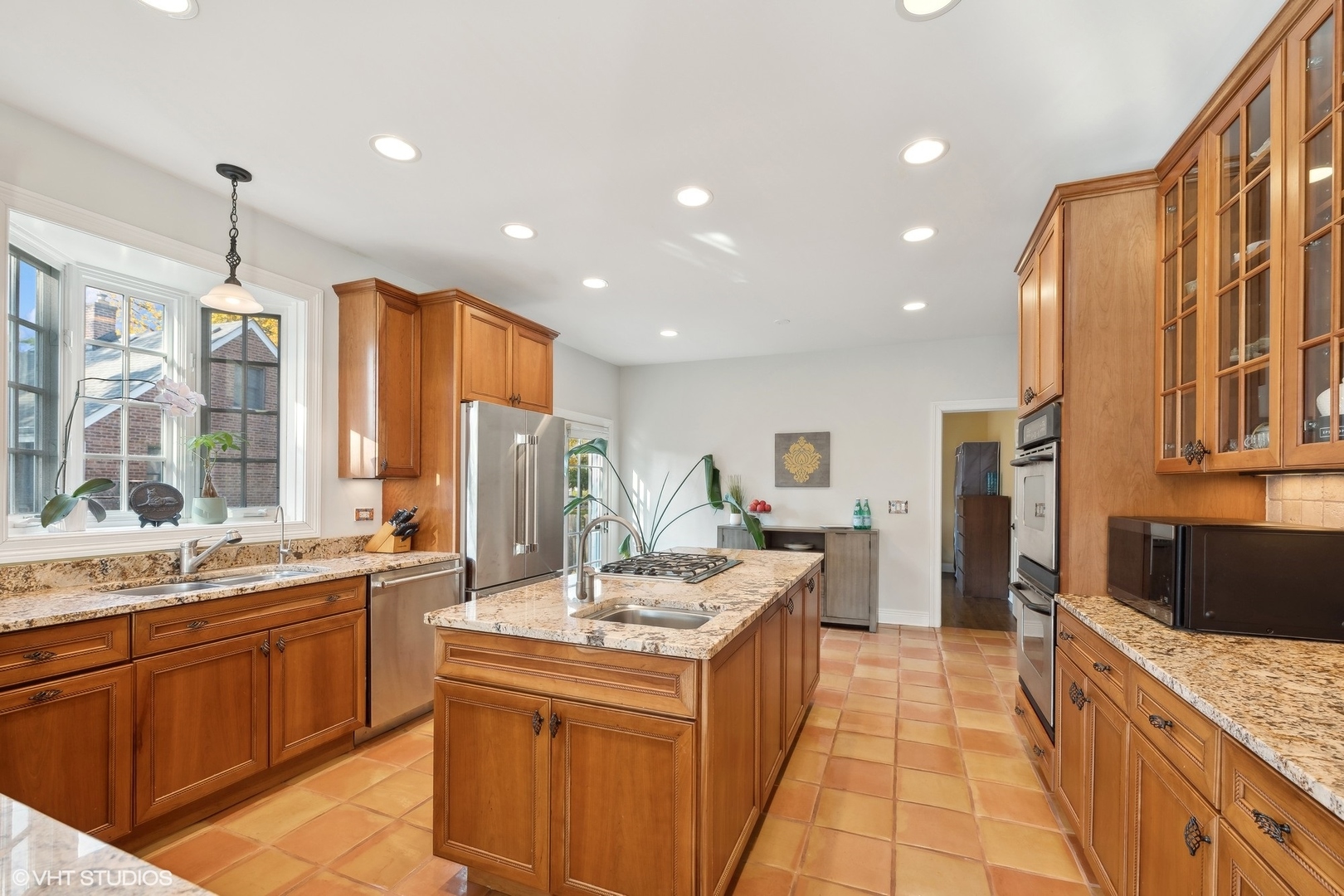 617 Hillside Road Glenview, IL 60025 - Photo 10 of 40 a kitchen with a sink stove and cabinets