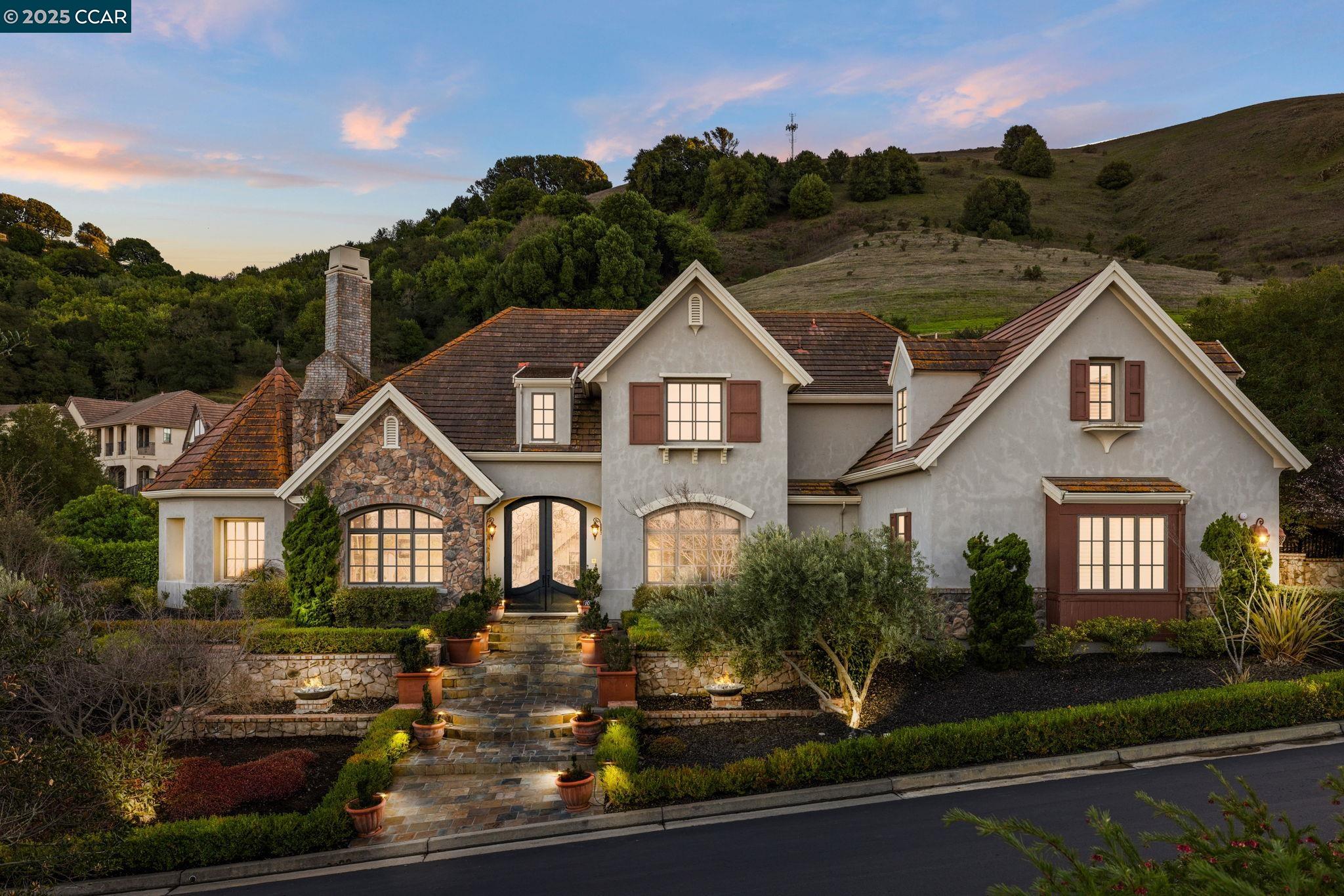 a front view of a house with a yard
