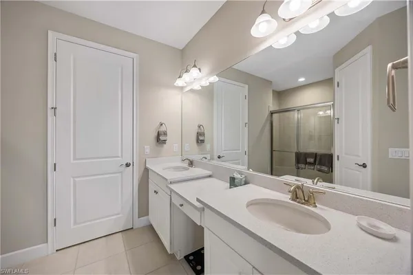 a bathroom with a sink vanity and a mirror