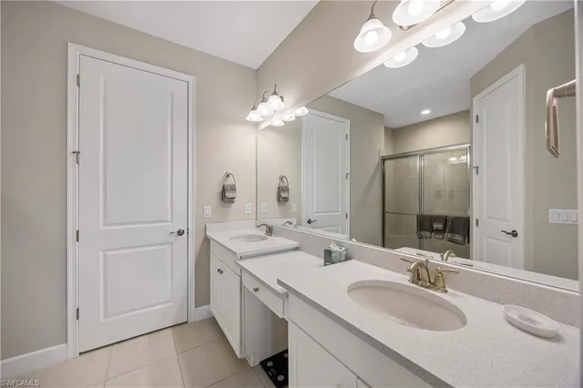 a bathroom with a sink vanity and a mirror