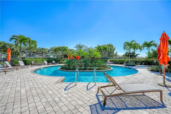 a view of a chairs and table in the patio