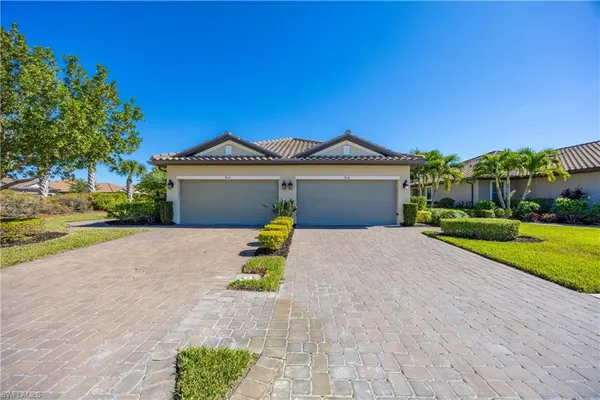 a view of a house with a yard and garage