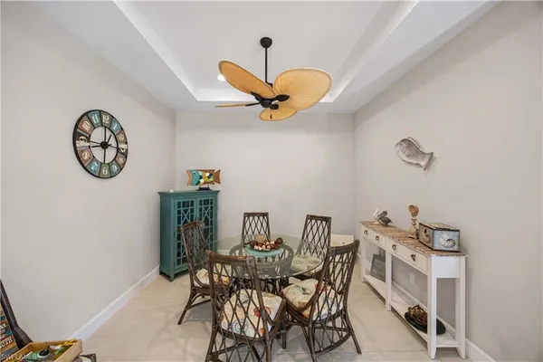a view of a dining room with furniture and front view