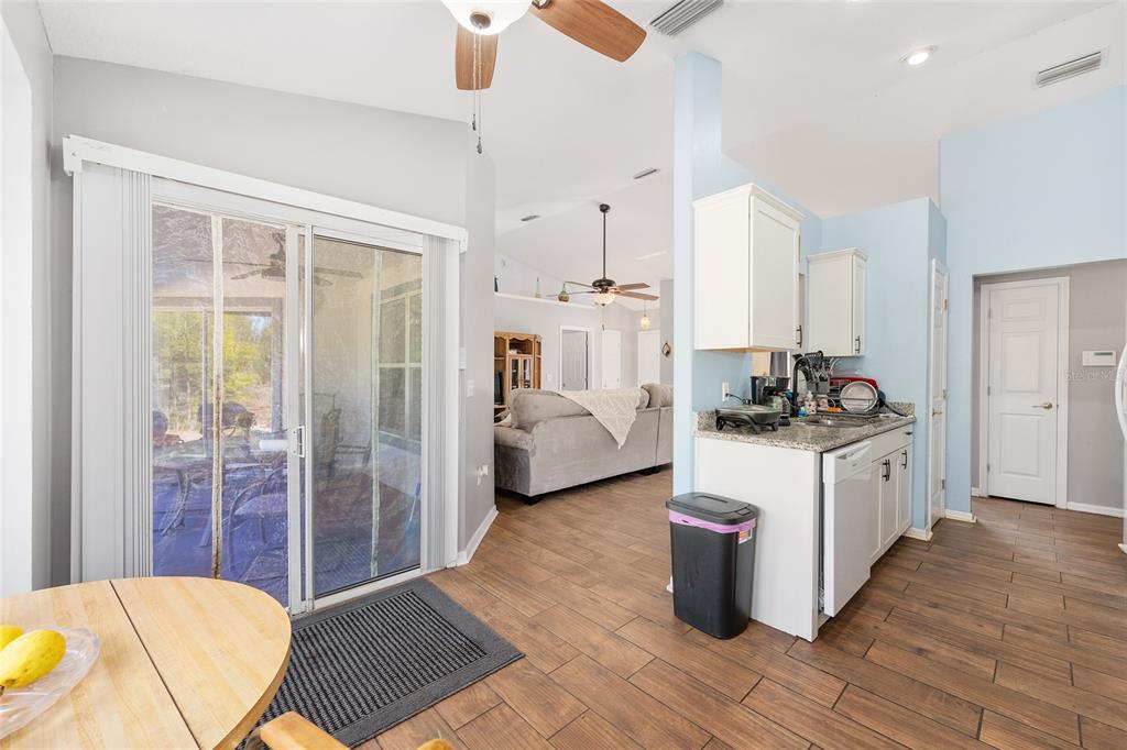 2219 Southwest 146th Loop Ocala, FL 34473 - Photo 15 of 32 a kitchen with sink and refrigerator