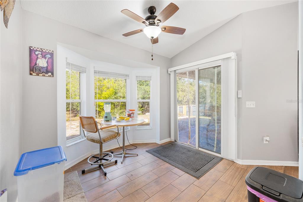 2219 Southwest 146th Loop Ocala, FL 34473 - Photo 17 of 32 a view of a workspace with furniture and a window