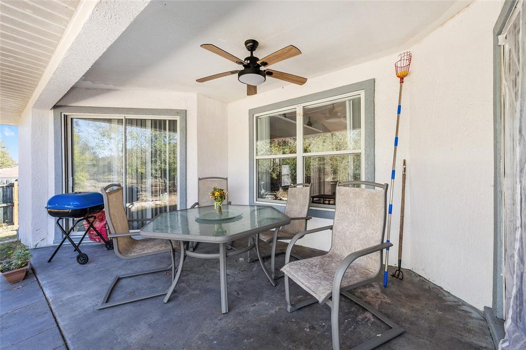 2219 Southwest 146th Loop Ocala, FL 34473 - Photo 18 of 32 a view of a dining room with furniture window and outside view