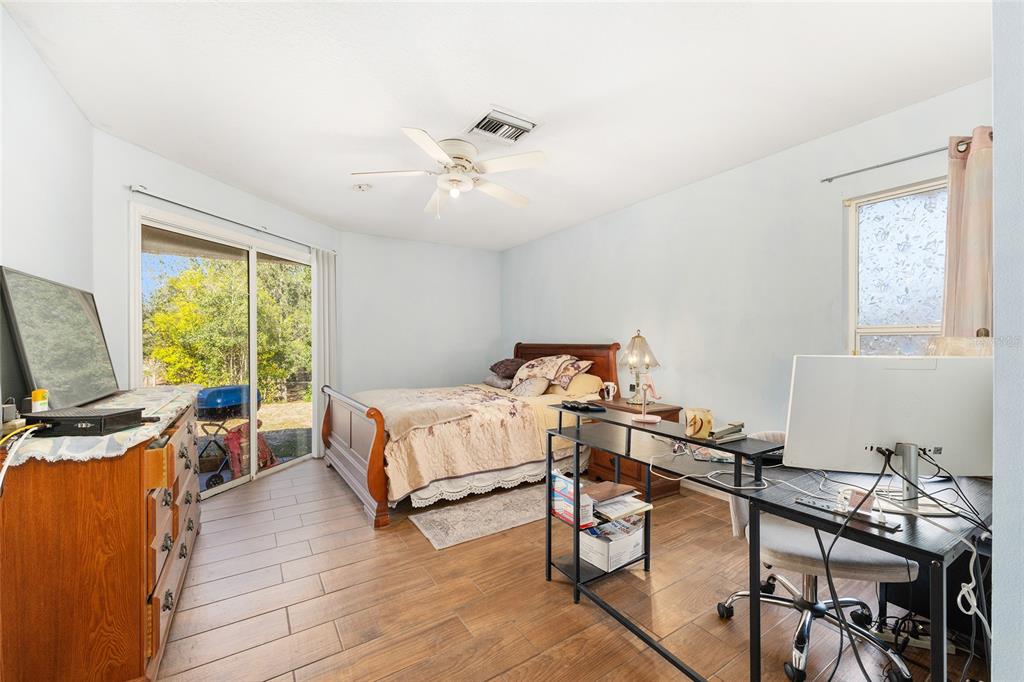 2219 Southwest 146th Loop Ocala, FL 34473 - Photo 19 of 32 a bedroom with furniture and a window