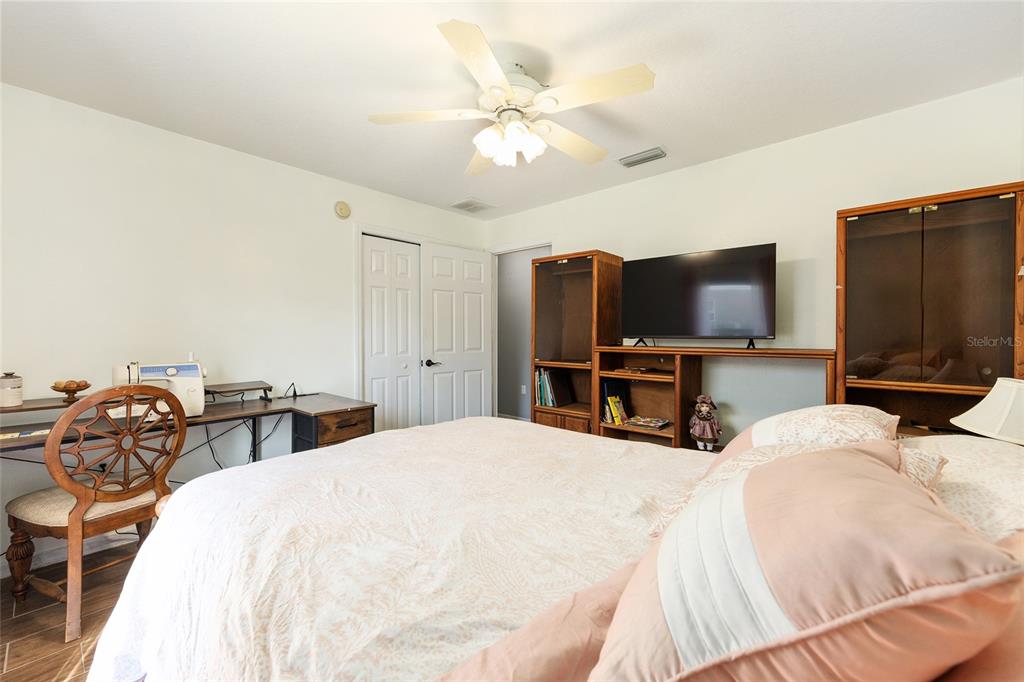 2219 Southwest 146th Loop Ocala, FL 34473 - Photo 23 of 32 a bedroom with bed and tv