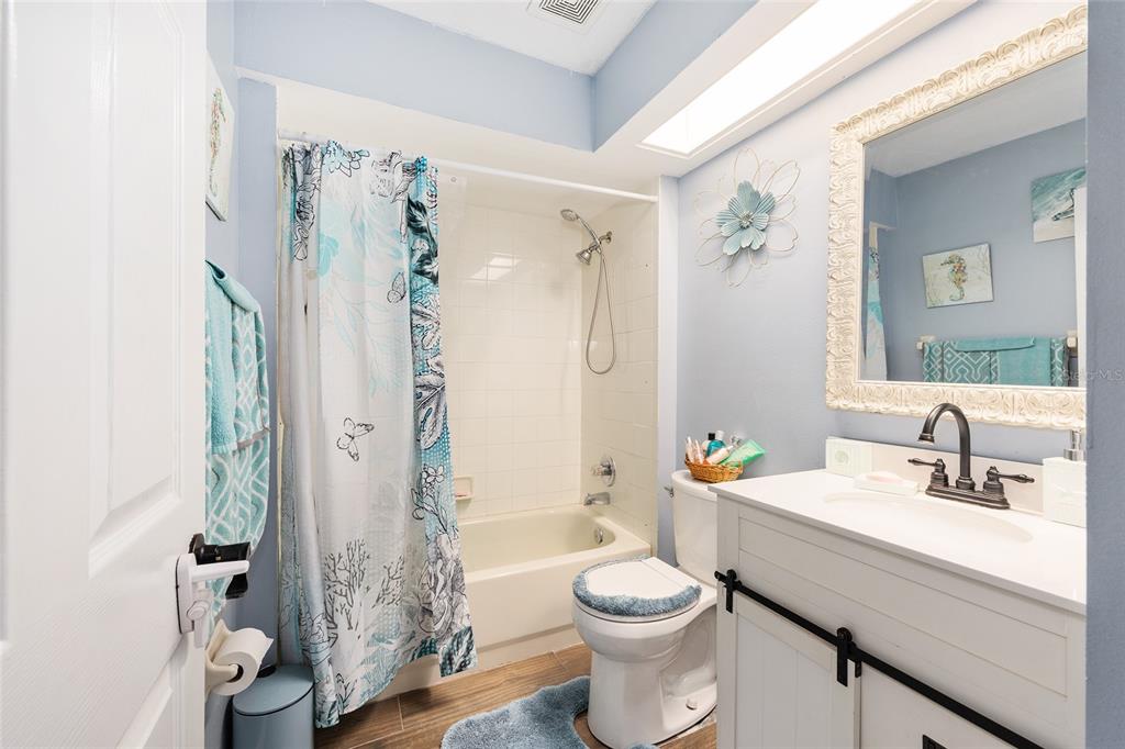 2219 Southwest 146th Loop Ocala, FL 34473 - Photo 25 of 32 a bathroom with a sink a toilet and shower