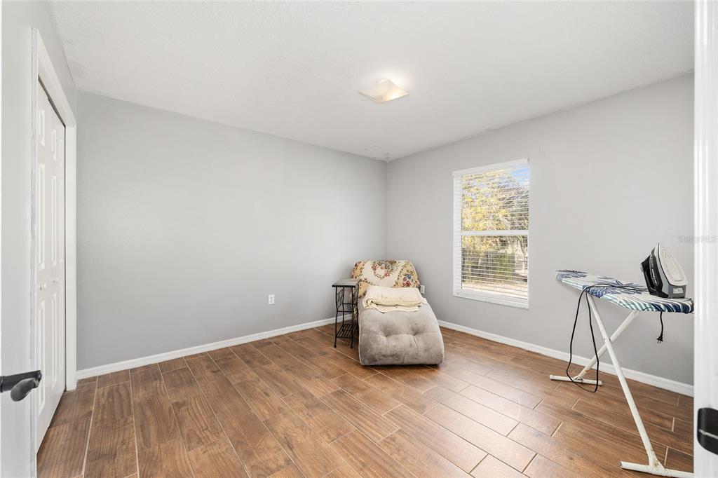 2219 Southwest 146th Loop Ocala, FL 34473 - Photo 26 of 32 a room with a bed and a window