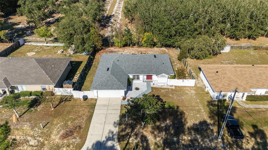 2219 Southwest 146th Loop Ocala, FL 34473 - Photo 31 of 32 an aerial view of a house with a yard