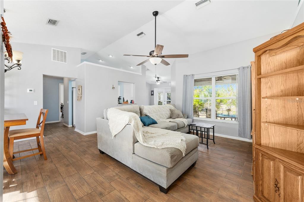 2219 Southwest 146th Loop Ocala, FL 34473 - Photo 5 of 32 a living room with furniture and a window
