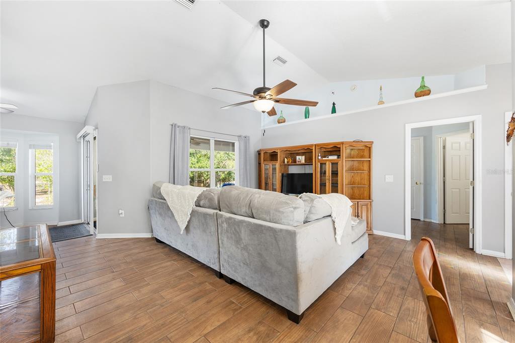 2219 Southwest 146th Loop Ocala, FL 34473 - Photo 6 of 32 a living room with furniture and a window