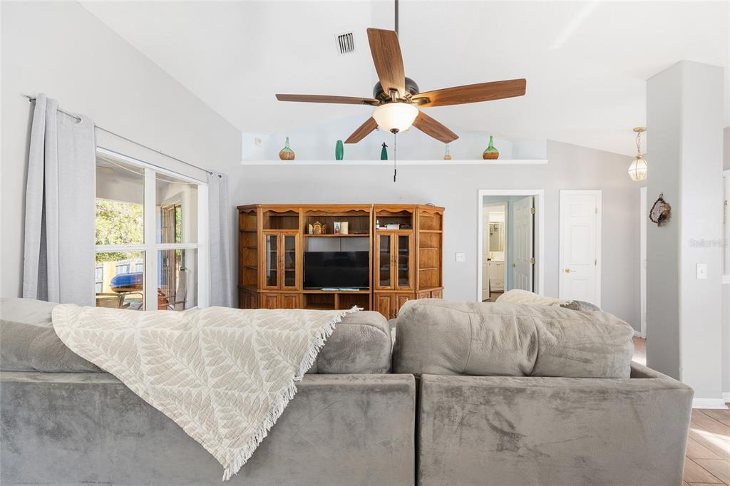 2219 Southwest 146th Loop Ocala, FL 34473 - Photo 7 of 32 a living room with furniture and a large window