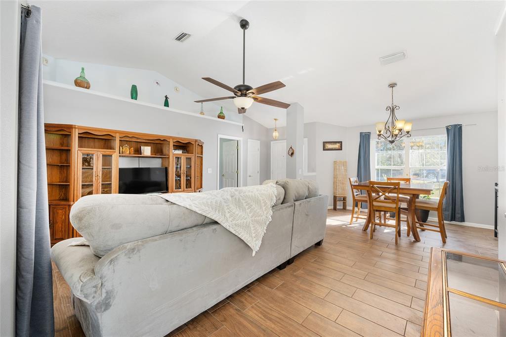 2219 Southwest 146th Loop Ocala, FL 34473 - Photo 8 of 32 a living room with furniture and a table