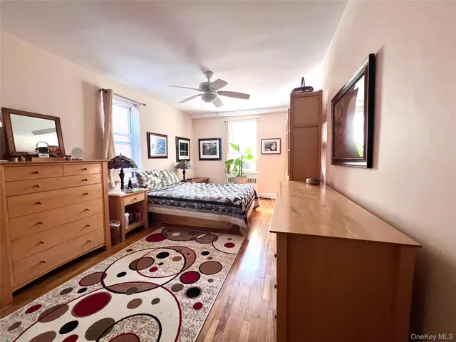a bedroom with a bed and a dresser in it