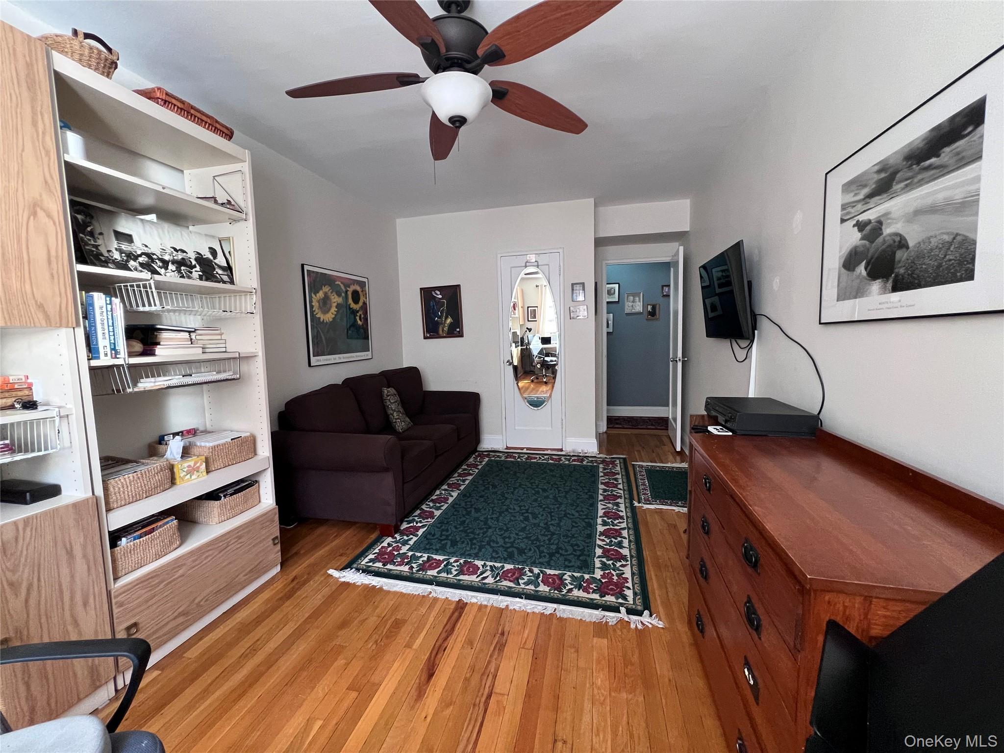 2080 Barnes Avenue, Unit 5C Bronx, NY 10462 - Photo 13 of 13 a living room with furniture and a rug
