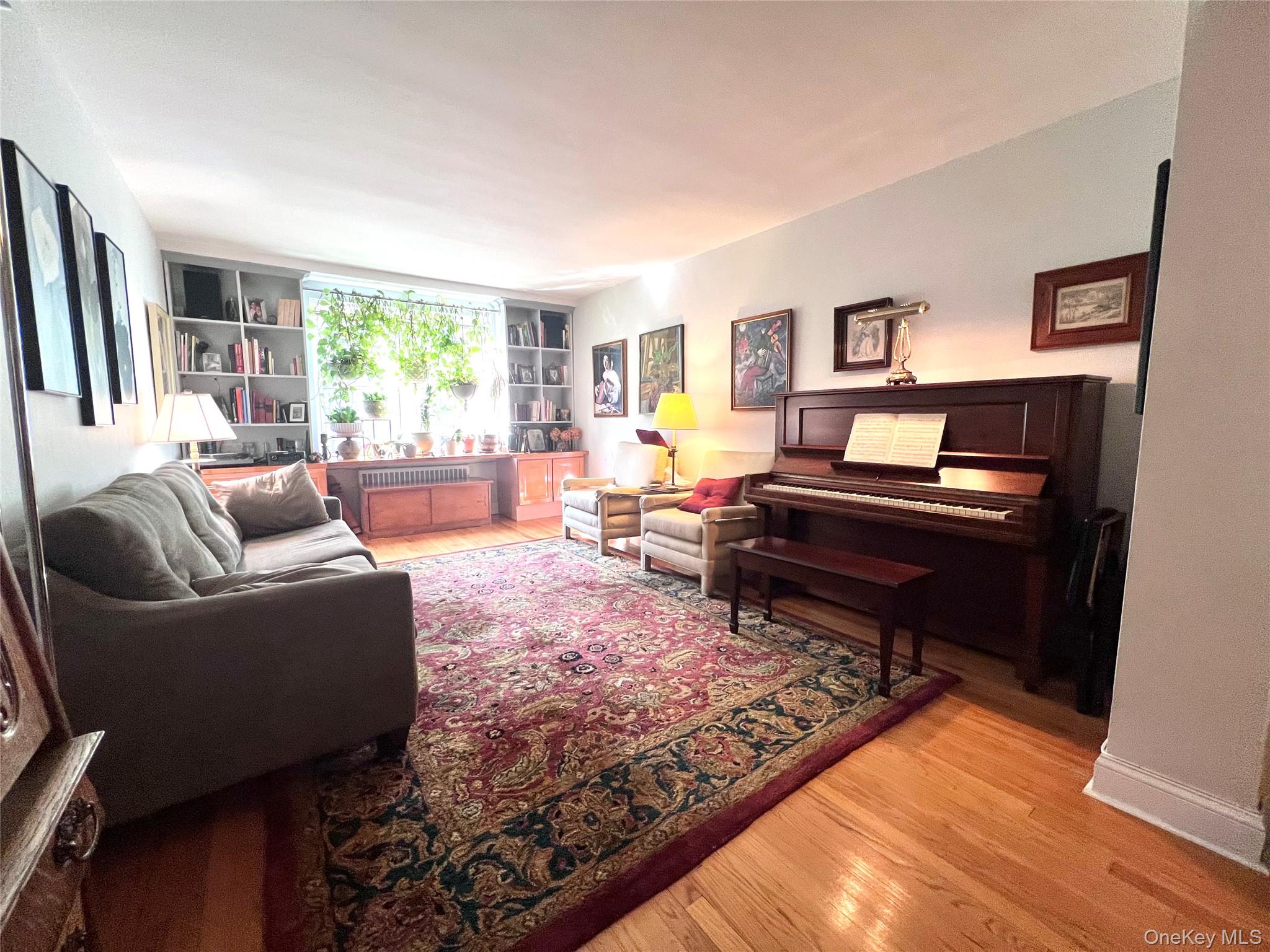 2080 Barnes Avenue, Unit 5C Bronx, NY 10462 - Photo 8 of 13 a living room with furniture and a rug