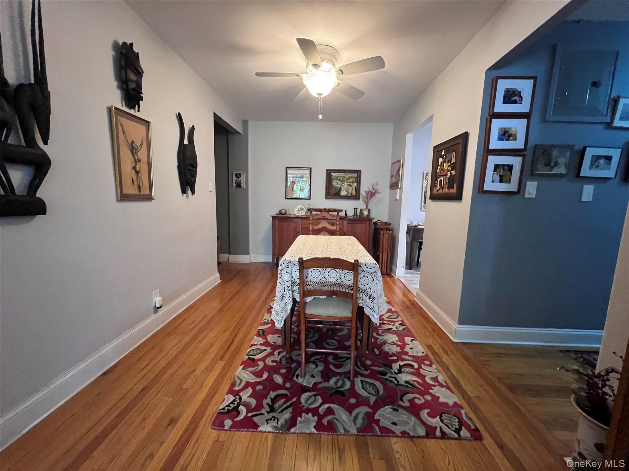 2080 Barnes Avenue, Unit 5C Bronx, NY 10462 - Photo 10 of 13 a living room with furniture and a wooden floor