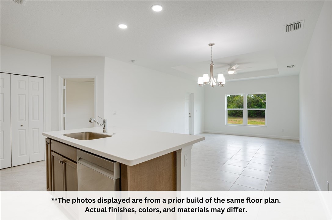 125 Admiral Circle Sebastian, FL 32958 - Photo 12 of 19 a open kitchen with a sink and a window