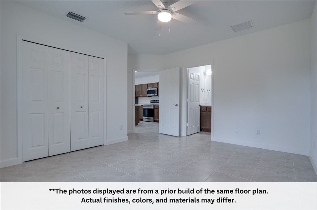 125 Admiral Circle Sebastian, FL 32958 - Photo 17 of 19 a view of an empty room with a ceiling fan and window