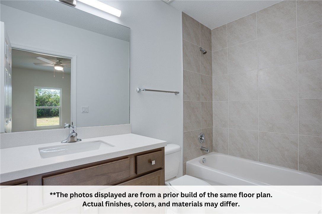 125 Admiral Circle Sebastian, FL 32958 - Photo 18 of 19 a bathroom with a sink a toilet and shower