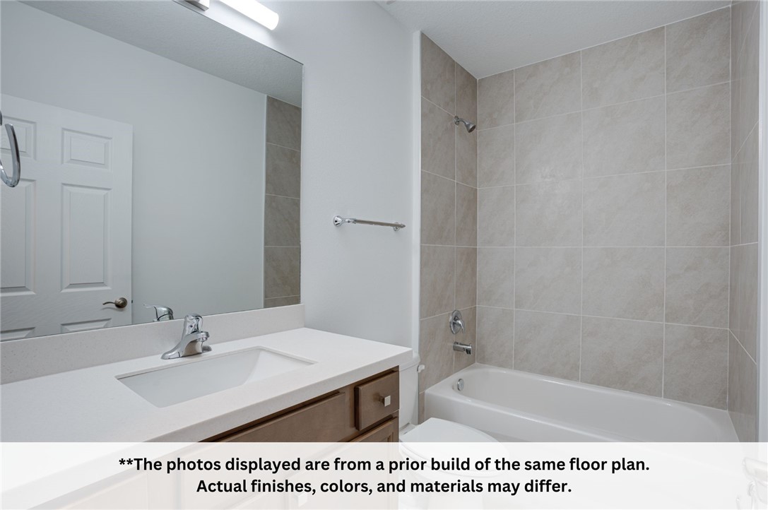 125 Admiral Circle Sebastian, FL 32958 - Photo 8 of 19 a bathroom with a sink a toilet and shower