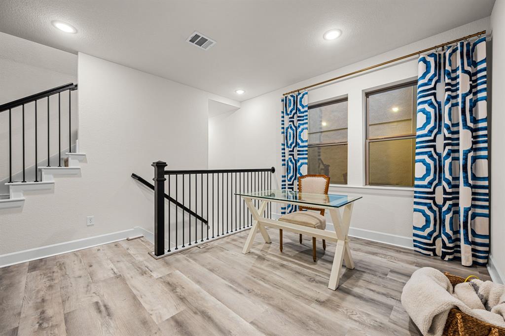 5325 Autumnbrook Court Dallas, TX 75209 - Photo 13 of 38 a living room with furniture and a window