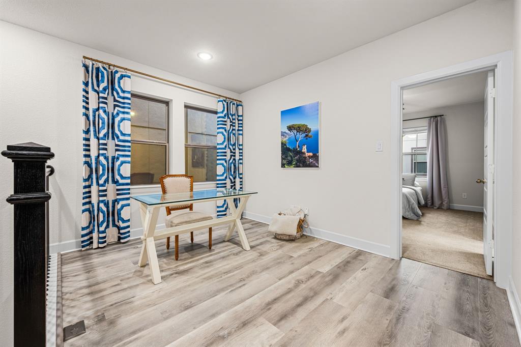 5325 Autumnbrook Court Dallas, TX 75209 - Photo 14 of 38 a living room with furniture and a wooden floor