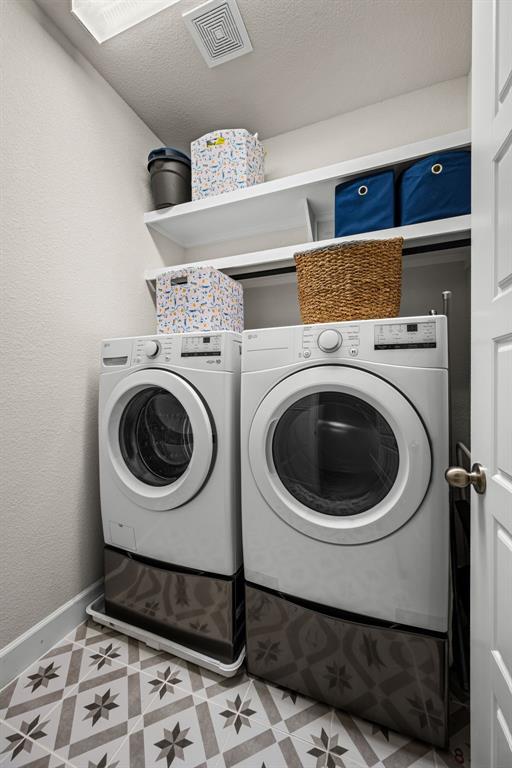 5325 Autumnbrook Court Dallas, TX 75209 - Photo 22 of 38 a utility room with dryer and washer