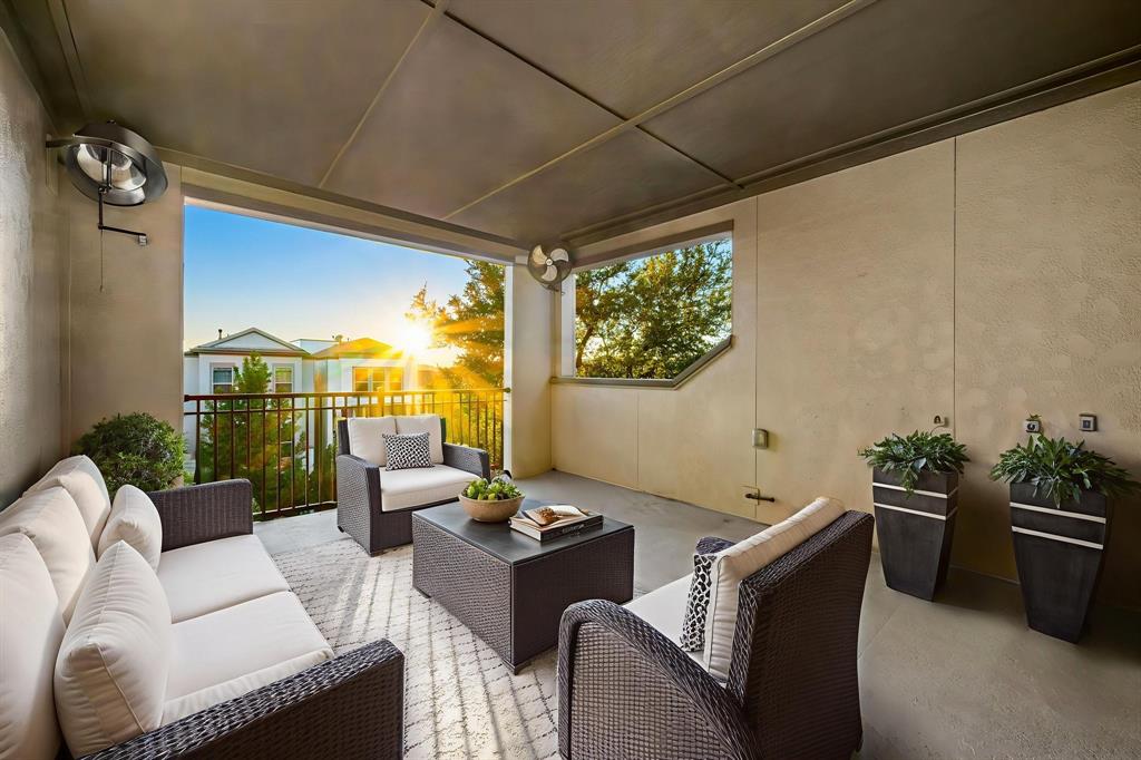 5325 Autumnbrook Court Dallas, TX 75209 - Photo 27 of 38 a living room with furniture and a large window