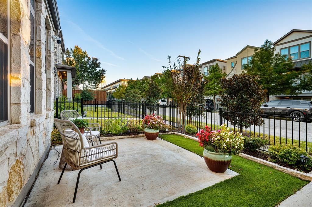 5325 Autumnbrook Court Dallas, TX 75209 - Photo 3 of 38 a garden with flowers in front of it