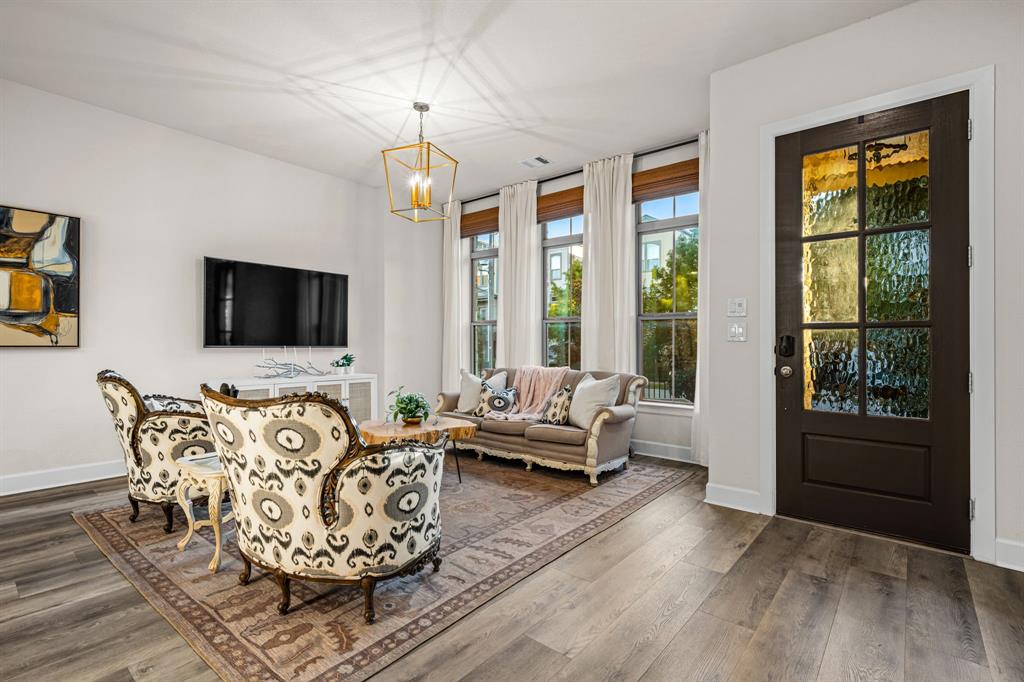 5325 Autumnbrook Court Dallas, TX 75209 - Photo 4 of 38 a living room with furniture or chandelier and a flat screen tv