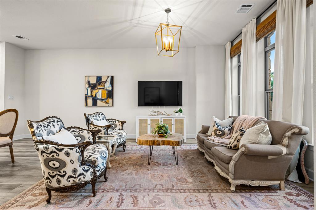 5325 Autumnbrook Court Dallas, TX 75209 - Photo 6 of 38 a living room with furniture fireplace and a flat screen tv