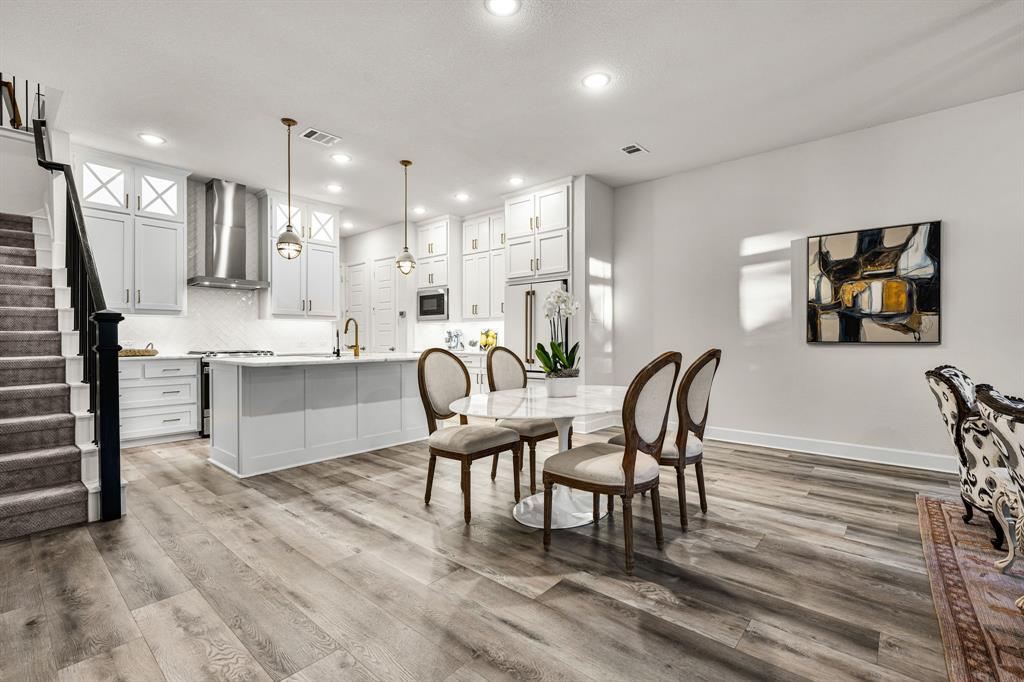 5325 Autumnbrook Court Dallas, TX 75209 - Photo 7 of 38 a large kitchen with a table and chairs