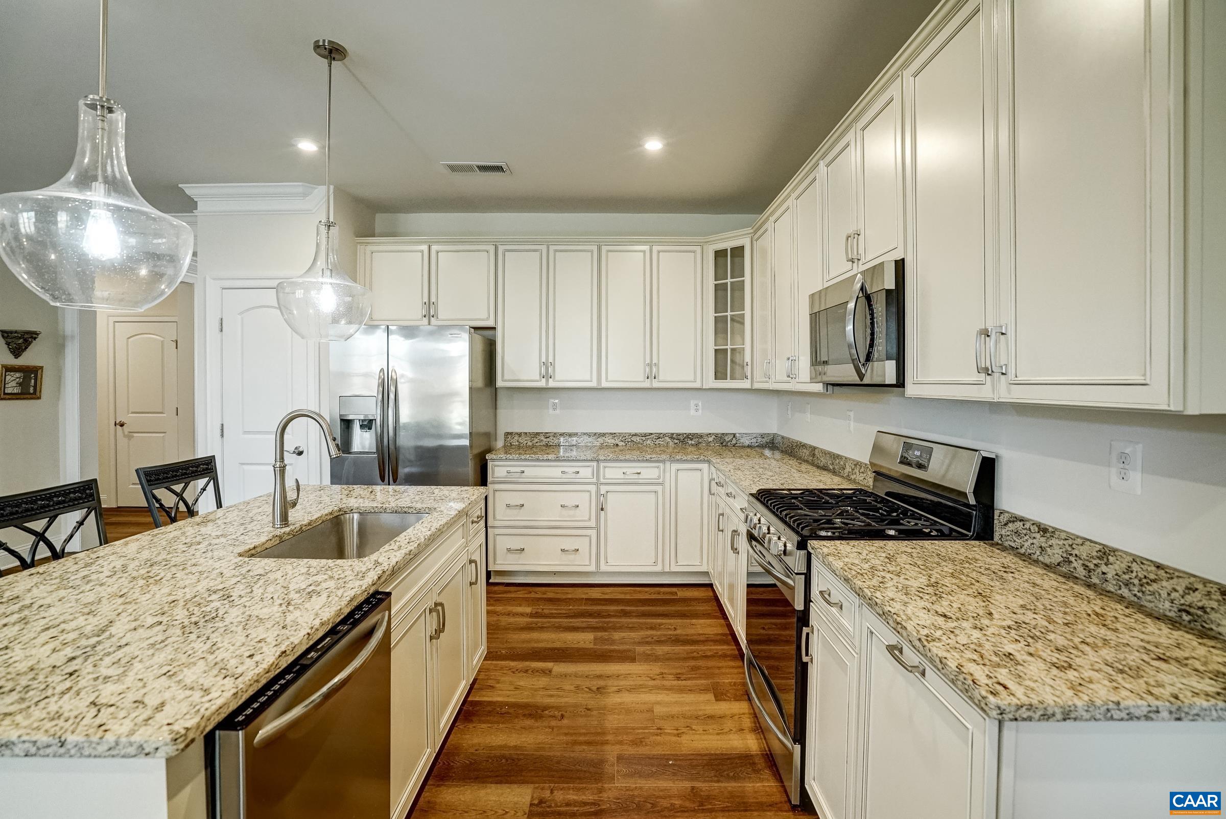 146 Timber Ridge Lane Zion Crossroads, VA 22942 - Photo 13 of 31 a kitchen with stainless steel appliances granite countertop a sink stove and refrigerator