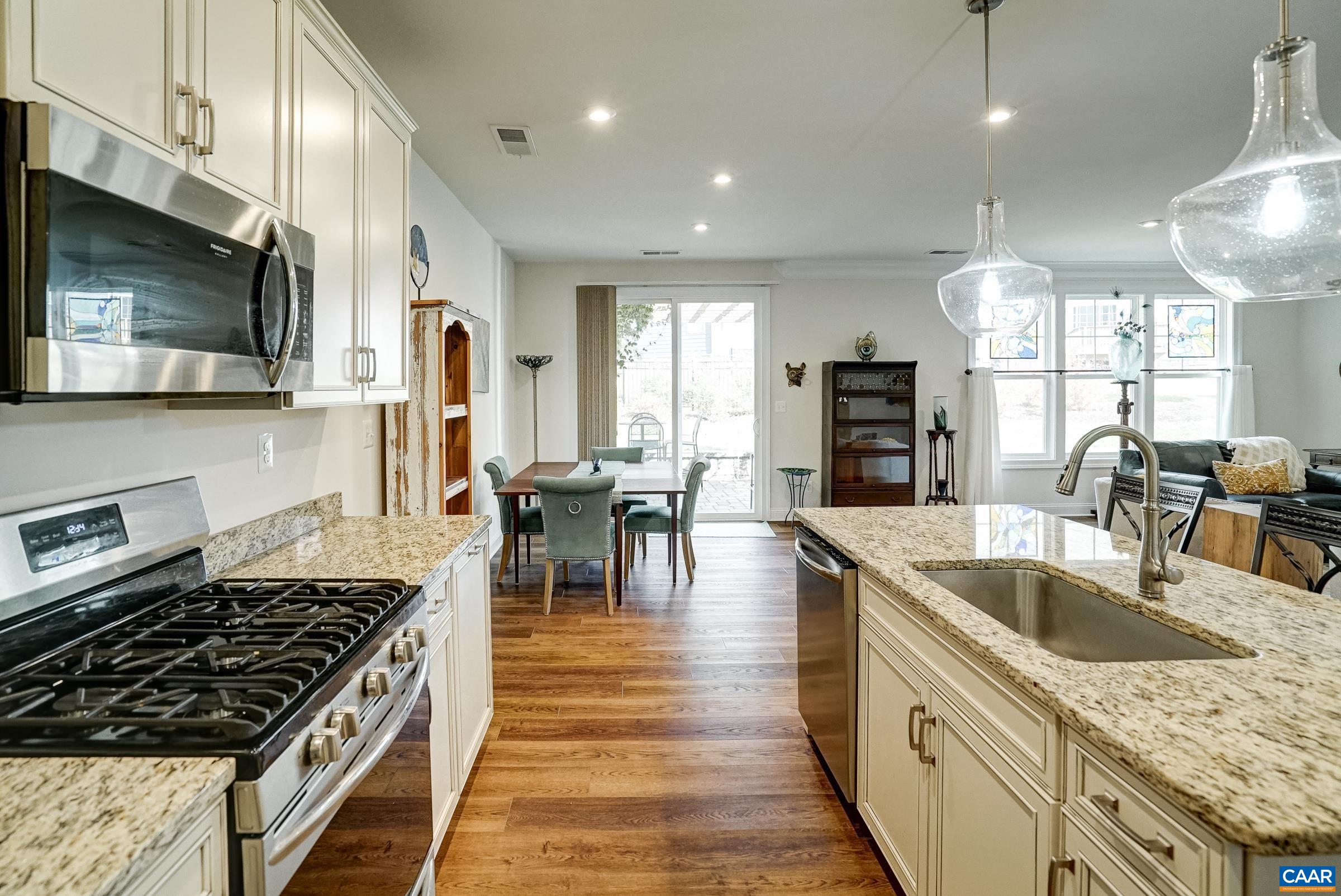 146 Timber Ridge Lane Zion Crossroads, VA 22942 - Photo 14 of 31 a kitchen with granite countertop a stove and a sink