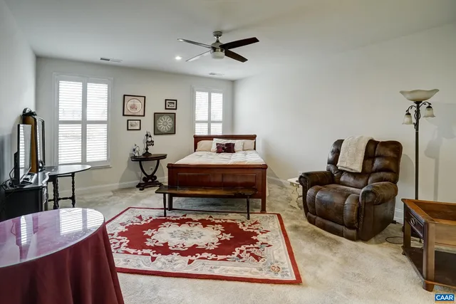 a living room with a couch and a window