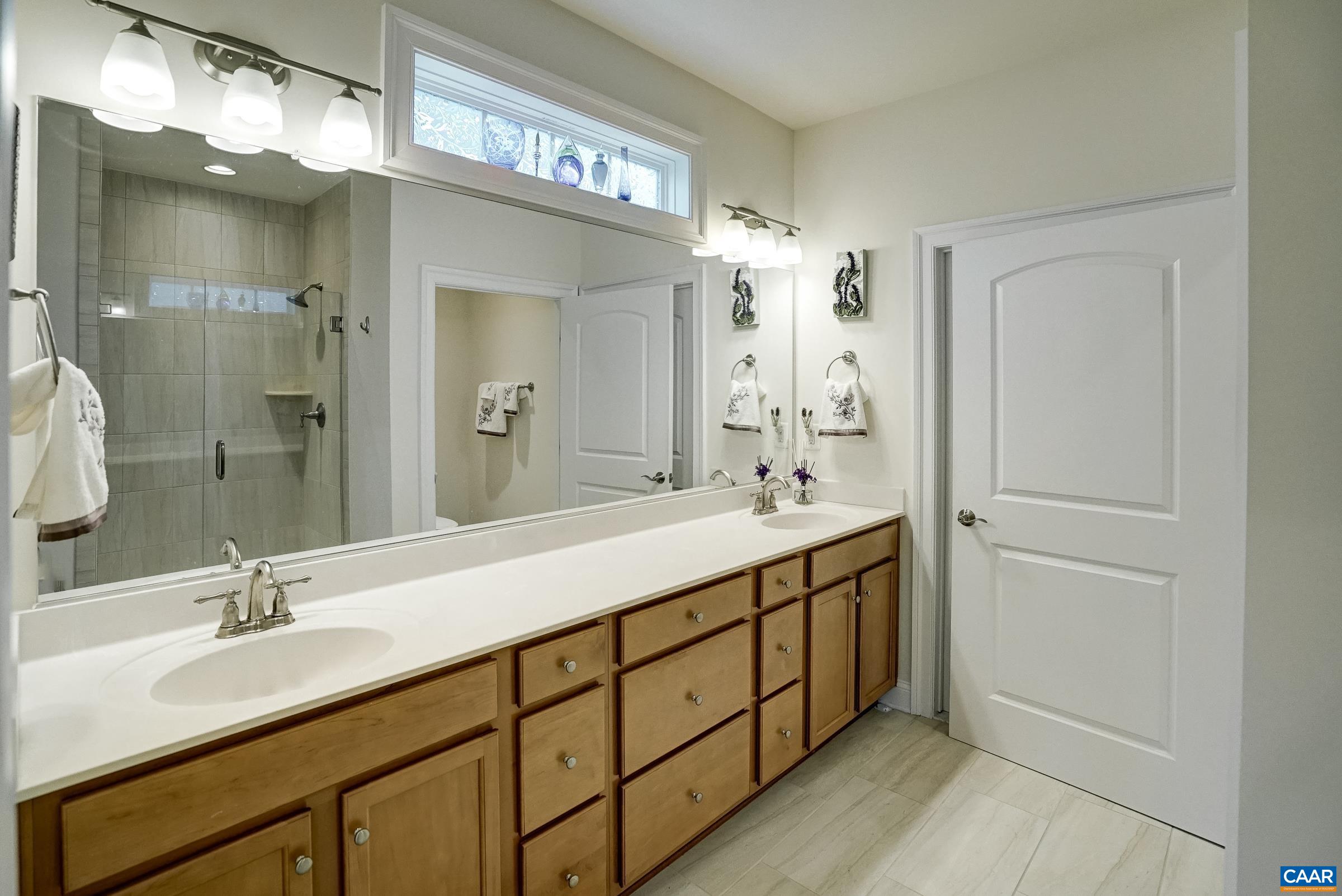 146 Timber Ridge Lane Zion Crossroads, VA 22942 - Photo 24 of 31 a bathroom with a double vanity sink mirror and