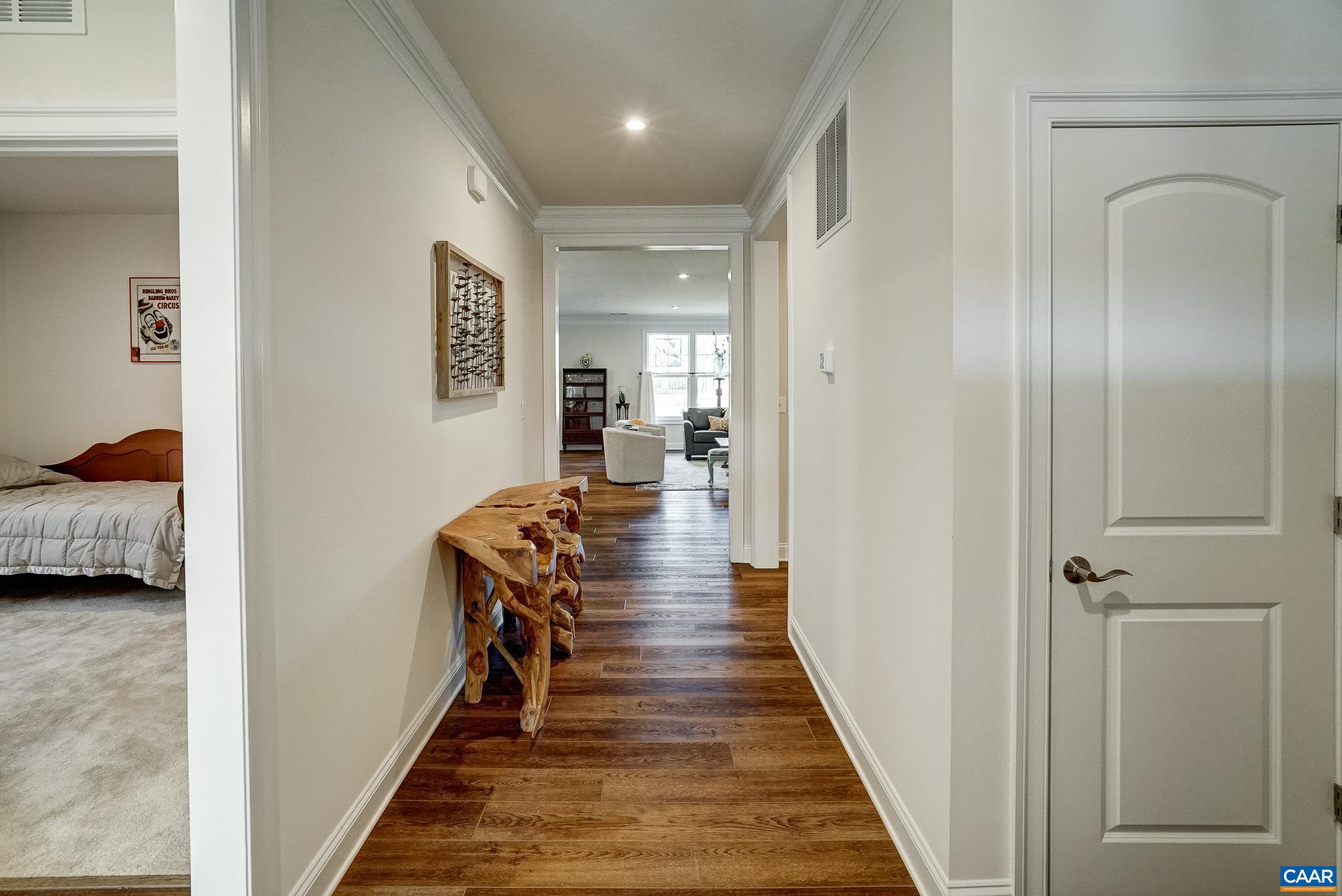 146 Timber Ridge Lane Zion Crossroads, VA 22942 - Photo 3 of 31 a view of a hallway with a bed and wooden floor