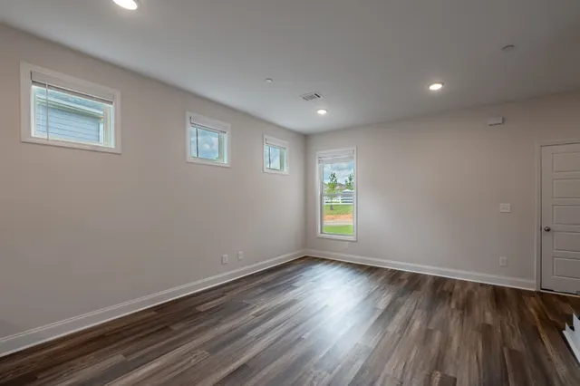 a view of room with window and hardwood floor