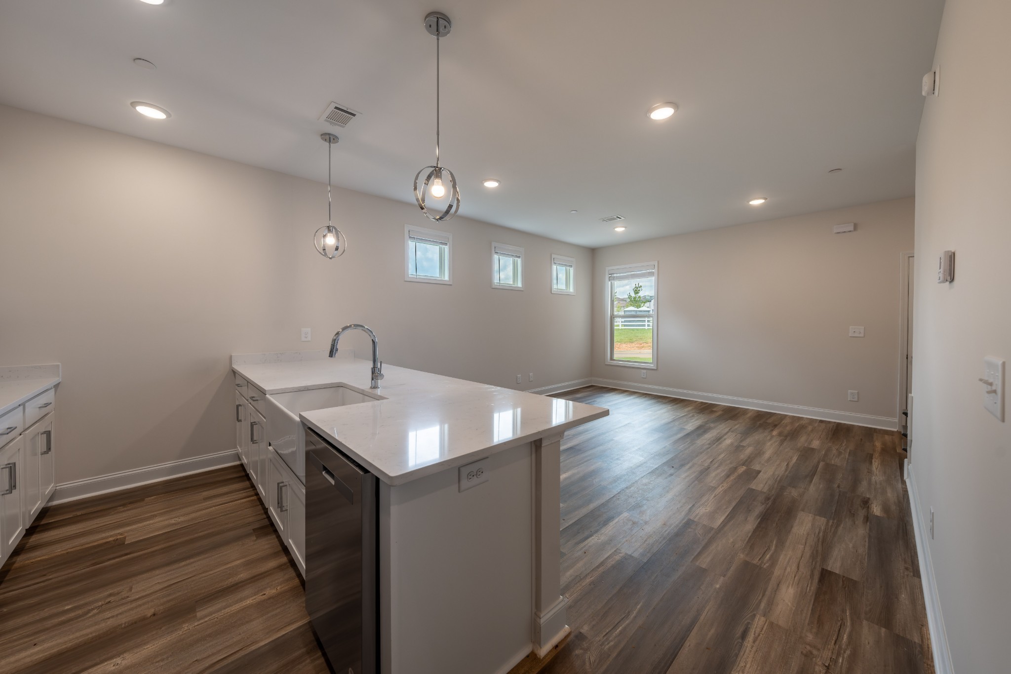 224 Franklin Street Pleasant View, TN 37146 - Photo 24 of 29 a kitchen with stainless steel appliances granite countertop a sink stove and wooden floor