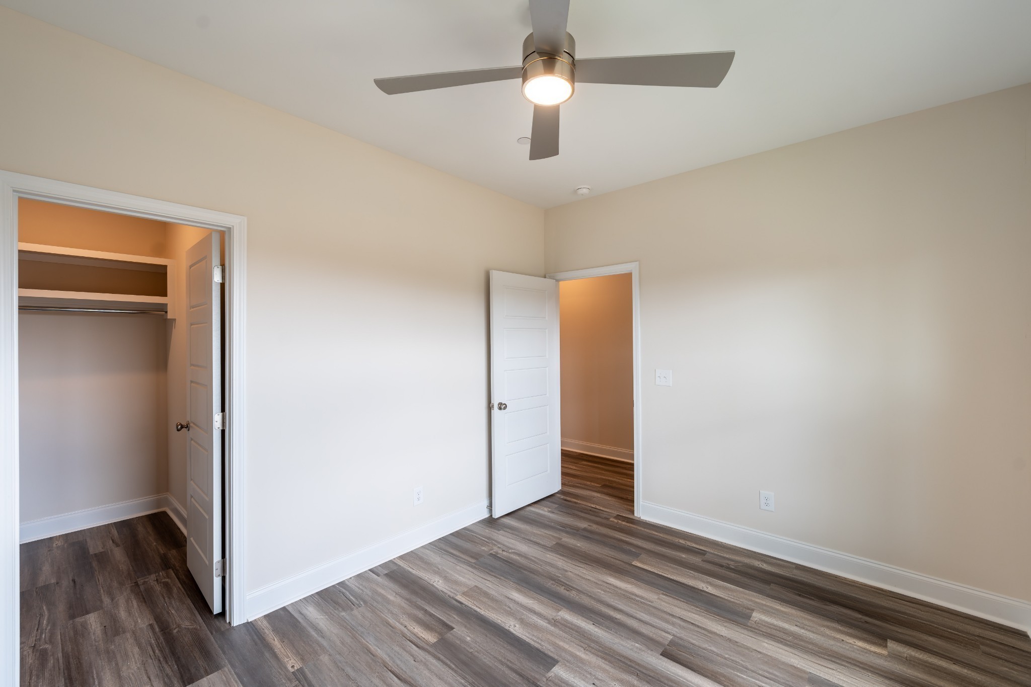 224 Franklin Street Pleasant View, TN 37146 - Photo 10 of 29 an empty room with wooden floor closet and ceiling fan