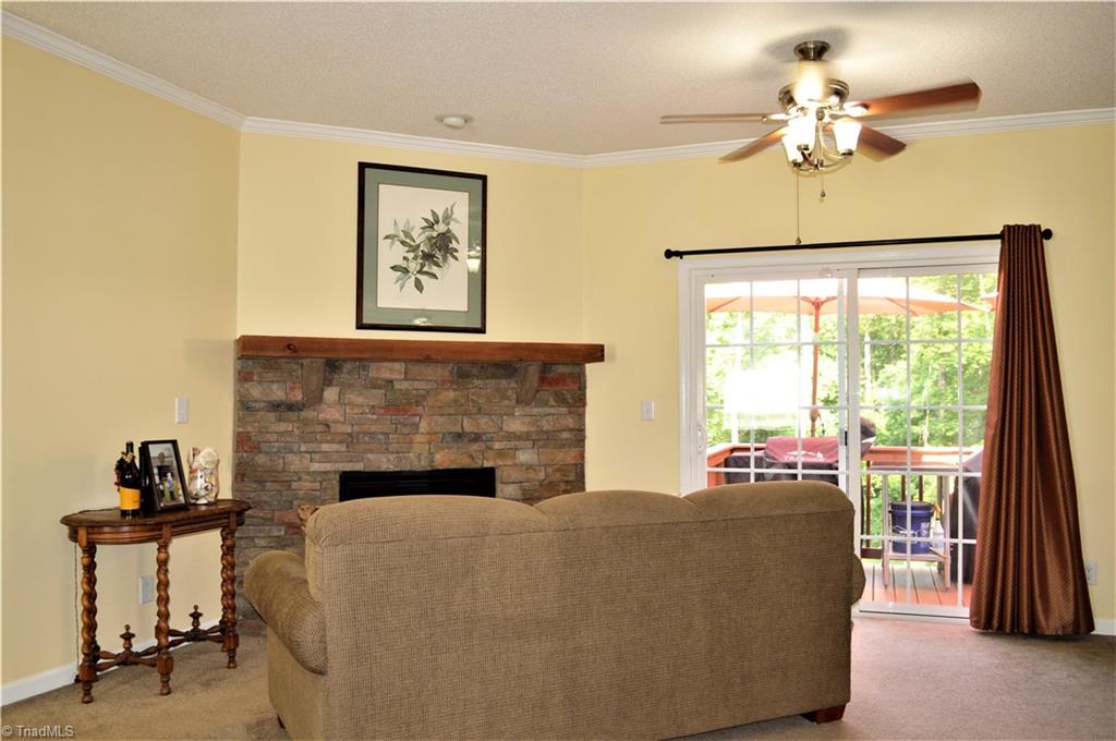 1387 Stewart Road Walnut Cove, NC 27052 - Photo 10 of 30 Den has rock fireplace with gas logs
