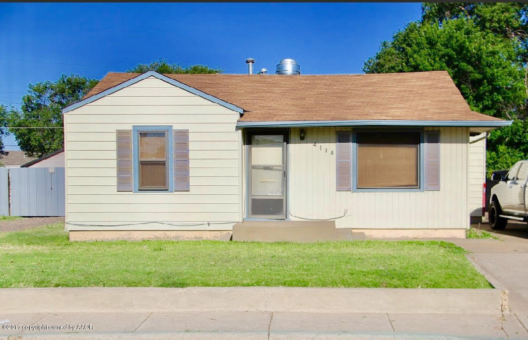 4118 South Washington Street Amarillo, TX 79110 - Photo 12 of 18 a front view of a house with a yard