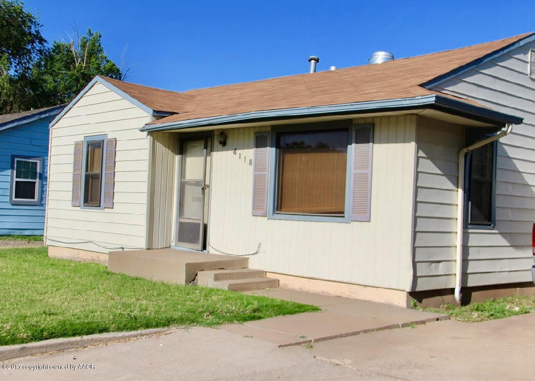 4118 South Washington Street Amarillo, TX 79110 - Photo 13 of 18 a view of a white house with a yard
